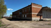Имущественный комплекс 4717,6 кв.м. с газом, котельной и 400 кВт на участке 1,5 га под производство/склад. Новосибирская обл., р.п. Колывань, ул. Шоссейная, 41/2.